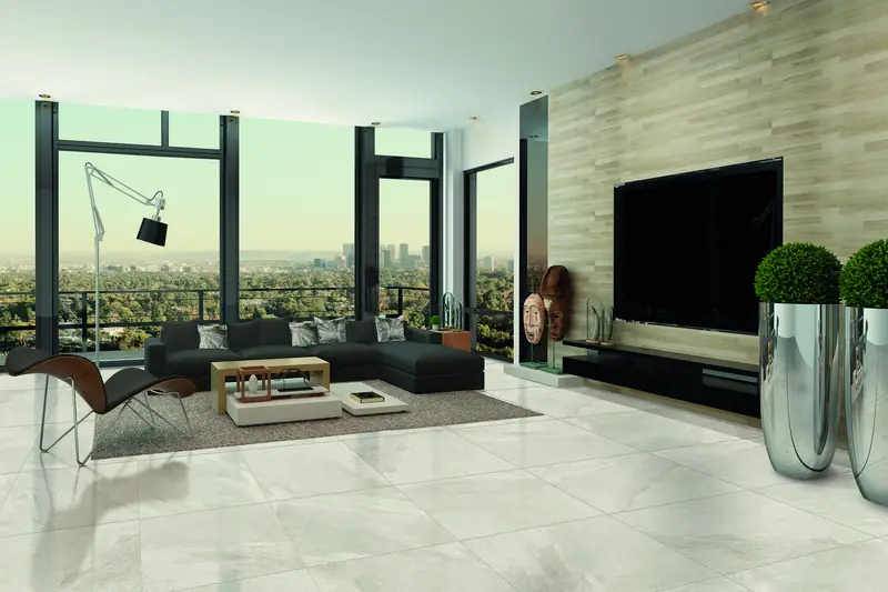 Bright open-plan living space with large-format light Italian porcelain flooring